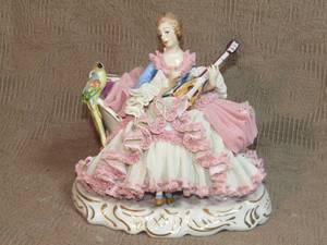 lot 138 image: Dresden lady with instrument and parrot figurine, Large size