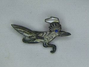 lot 179 image: Sterling Silver Roadrunner Nurse recognition pin with blue precious stone eye