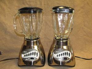 lot 199 image: Oster 16 speed all metal drive Blenders, set of 2