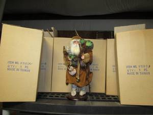 lot 221 image: Collection of six Santas on stands (can is for size purposes only)