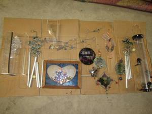 lot 309 image: Assortment of bird feeders, wind chines, suncatchers, etc