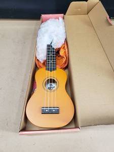 lot 264 image: Amahi Penguin Tropical Series Ukulele w Bag.  Color Orange, Model AMA-PGUKOR