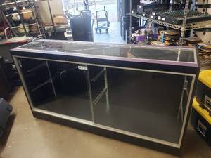 lot 356 image: Large Rolling Glass Display Case.  Includes 4 Glass Shelves (Not Pictured) Cabinet is Locked.  NO KEYS.