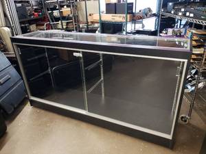 lot 359 image: Large Rolling Glass Display Case.  Includes 4 Glass Shelves (Not Pictured) Cabinet is Locked.  NO KEYS.