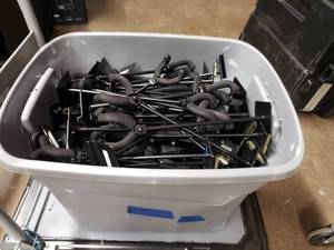 lot 372 image: Large Tote FULL of Slat Wall Guitar Hangars & Ingles Slat Wall Adjustable Display Arms