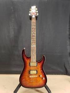 lot 24 image: Beautiful Schecter Diamond Series C1 Classic Solid Body 3-Tone Sunburst Electric Guitar w Case