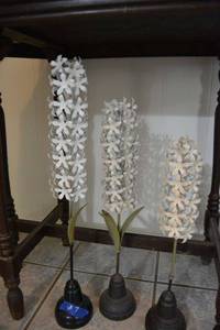 lot 7 image: Set of 3 metal flower stands. Features heavy iron bases