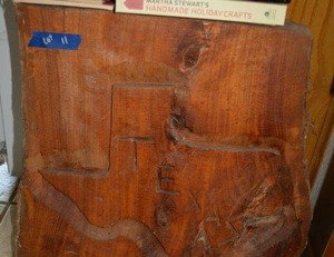 lot 11 image: Partial tree stump with Texas carving (HEAVY, bring help or equipment to remove)