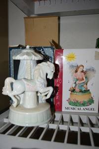 lot 34 image: Music boxes - Resin angel and porcelain horse