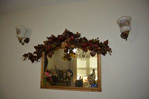 lot 44 image: Vintage wall lamps, mirror and dcor (bring tools to remove, sconces are wired)