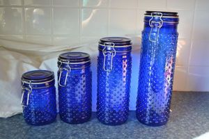 lot 62 image: Blue hobnail glass cannister set