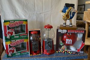 lot 79 image: Candy dispensers - M&M dispensers and M&M candy jars, plus Gum Ball machines