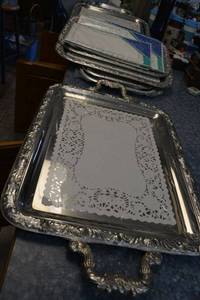 lot 119 image: Rectangular serving trays and doilies (heavy metal trays, no markings)