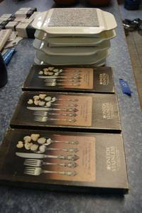 lot 121 image: Silverware set for 12, and microwaveable hot plates