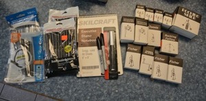 lot 123 image: Unopened pens, Steno pad, metal balancing toys