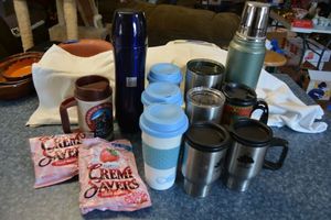 lot 122 image: Insulated travel mugs, vintage Stanley thermos, wrapped candies