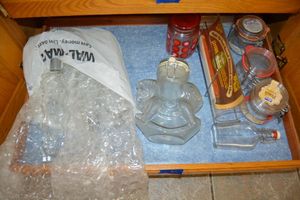 lot 93 image: Kitchen - Glass jars with latch closures includes one rocking horse design, set of 3 wavy bottles, Pyrex glass for baking round bread loaves