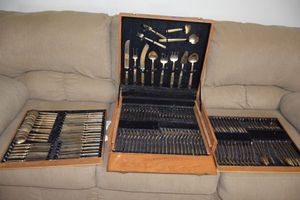 lot 161 image: Large flatware set. Appears to be brass, marked Thailand.