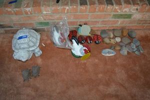lot 144 image: Garden turtles, smooth and painted rocks and motion sensor roosters