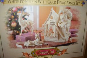 lot 311 image: White porcelain with gold firing Santa set