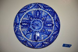 lot 320 image: Decorative wall plates and wood carved faces (see all photos)