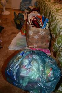 lot 192 image: Christmas gift bags, ornaments, ribbons and bows