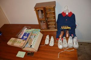 lot 254 image: Vintage baby shoes, baby outfit, jewelry box, and craft sets