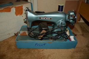 lot 253 image: Vintage sewing machine by Sew Mor. Number J-A34  C21092. Plus cutting board