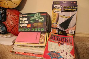 lot 438 image: Books, Night vision Optics and Slim Away wrap