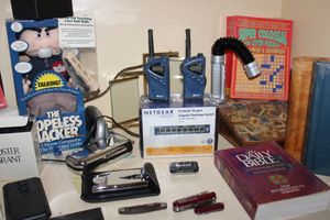 lot 459 image: Misc. mens lot - includes Hopeless Hacker Doll, lighters, Netgear router, Bibles and more