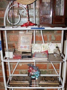 lot 463 image: Misc. contents of rack - jewelry box, puzzle books, pair of jewelry boxes and jewelry