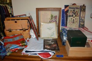 lot 596 image: Misc. lot - flags, shoe box with cleaners, Lace handkerchief, silk scarfs, autographed Branson photo and more