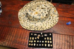 lot 589 image: Lapel pin collection with hat