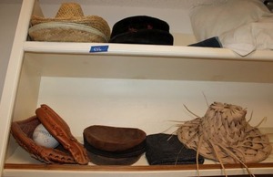 lot 556 image: Hats and softball glove with ball