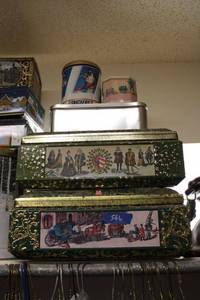 lot 566 image: Cookie tins as shown