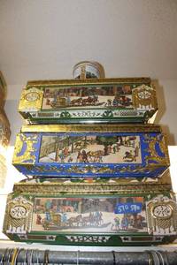 lot 570 image: Cookie tins as shown