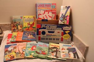 lot 632 image: Childrens Disney books, Play keyboard and guitar, puzzle books and magazines