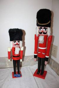 lot 648 image: Nutcrackers - 2 red with furry hats. Marked Hirschmann