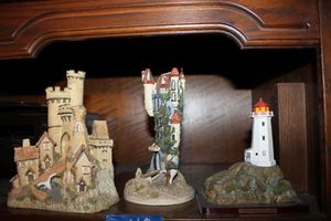 lot 668 image: Figurines Castle Boot by Jon Herbert, Castle Gate by David Winter, and Peggys Cove Lighthouse by Oneida