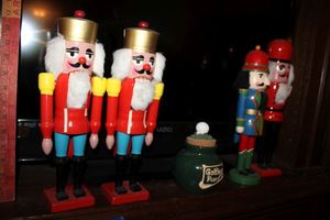 lot 671 image: Nutcrackers - 4 total, plus golf fund jar, see photos