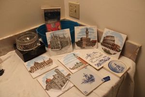 lot 607 image: Tile souvenirs, Lead crystal cat dish, and kitten puzzle