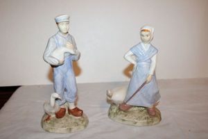 lot 697 image: Man and woman figurines with ducks