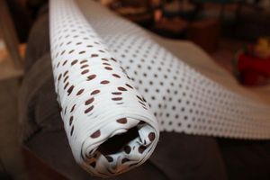 lot 833 image: Fabric bolt - white with brown polka dots