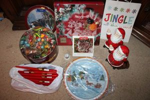 lot 718 image: Christmas ornaments, platters, red candles and Santa figurines