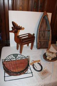lot 816 image: Misc. home dcor Wood boat, Wire and wicker wall shelf, wood deer, chicken with nest and Horseshoe dinner bell