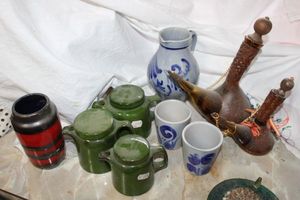 lot 825 image: Stoneware and matching wine decanters with leather sheath