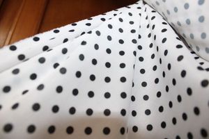 lot 843 image: Fabric Bolt - White with black polka dots