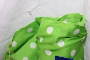lot 853 image: Fabric Bolt - Green with white polka dots