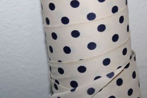 lot 852 image: Fabric Bolt - White with blue polka dots
