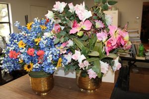 lot 885 image: (2) brass colored vases with flower arrangements